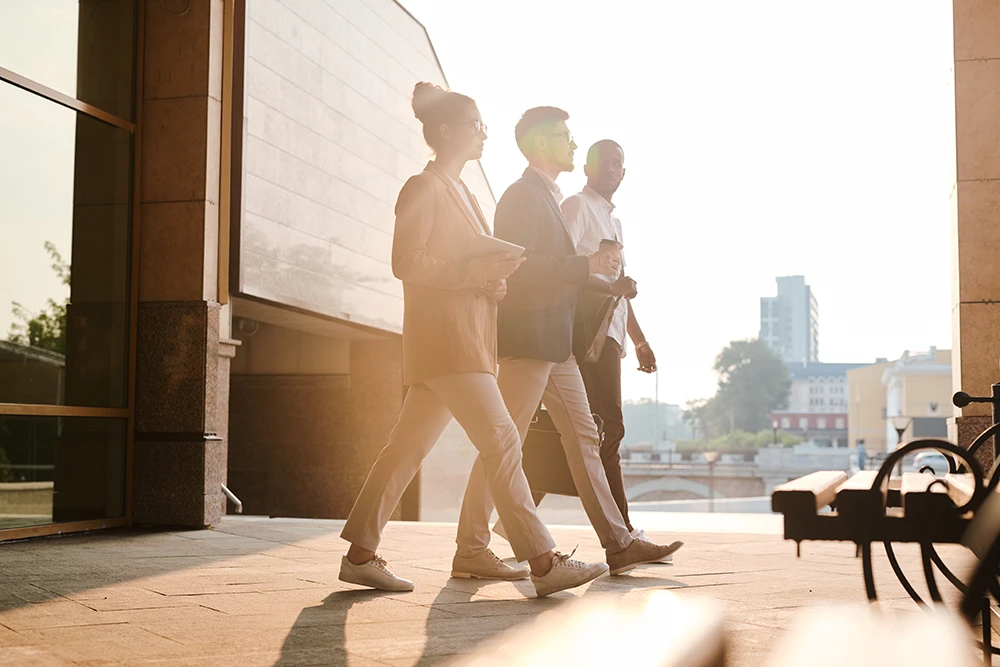 Business professionals commuting to work on a sunny morning, representing the growing workforce in The Colony and the Dallas-Fort Worth metroplex