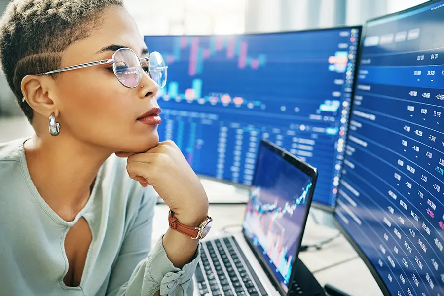 A financial analyst in Dallas analyzing data in her office.